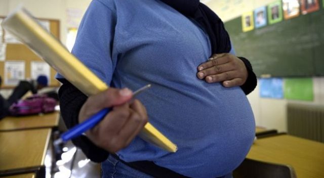 A-pregnant-student-poses-on-July-29-2013-in-Pretoria-at-the-Pretoria-Hospital-School-specialised-in-teenage-pregnancy.-AFP