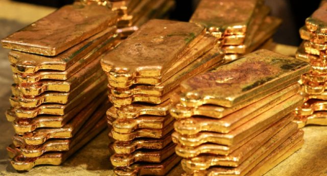 Gold-bullion-can-be-seen-after-being-removed-from-casts-at-the-ABC-Refinery-smelter-in-Sydney-on-Apr