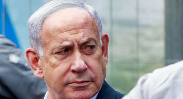 Israels-Prime-Minister-Benjamin-Netanyahu-visits-the-scene-of-a-shooting-at-the-Ramot-road-junction