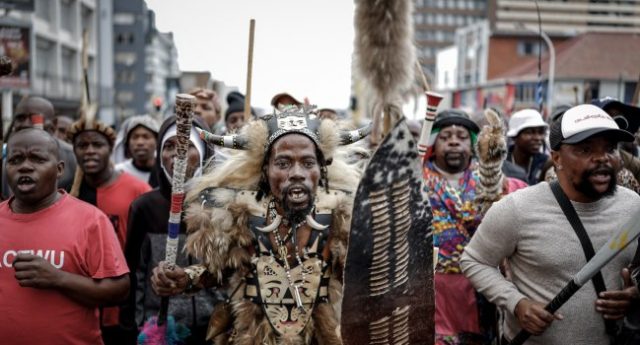 Members-of-the-Zulu-regiment-known-as-the-‘Amabutho-chant-slogans-as-they-march-during-a-demonstrat (1)