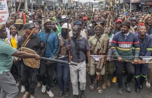 FG to seek compensation for returning Nigerians from South Africa – Envoy Members of the Zulu regiment known as the ‘Amabutho’ chant slogans as they march during a demonstration by the "March and March" movement marking an unofficial deadline set by citizen-led groups for undocumented foreign nationals to leave South Africa, in Durban, on June 30, 2026. Thousands of demonstrators massed across South African cities on June 30, 2026, venting anger at undocumented foreign nationals as police mounted a major operation to head off looting and xenophobic violence that has claimed four lives. The nationwide protests cap weeks of demonstrations called by a loose coalition of minor political parties and small citizen-led vigilante groups, which set an unofficial June 30 deadline for foreigners without residency papers to leave. (Photo by RAJESH JANTILAL / AFP)