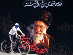 Supreme Leader’s Body Arrives At Tehran Religious Complex For Funeral billboard-featuring-a-portrait-of-Irans-slain-supreme-leader-Ali-Khamenei