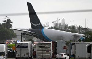 Five Dead, Five Injured As Amazon Cargo Plane Crashes Into Vehicle In Miami The-tail-section-of-a-cargo-plane-is-seen-at-Miami-International-Airport-after-it-overran-the-runway