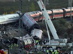Spain Begins Three-Day Mourning After Latest Train Tragedy Kills 68 A-truck-crane-is-operated-at-the-site-of-a-train-crash-between-two-high-speed-units-a-Renfe-AVE-tra