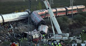 Spain Begins Three-Day Mourning After Latest Train Tragedy Kills 68 A-truck-crane-is-operated-at-the-site-of-a-train-crash-between-two-high-speed-units-a-Renfe-AVE-tra